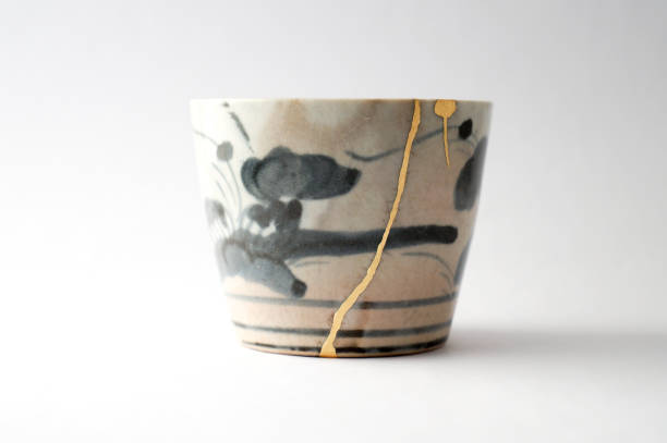 istock Antique broken Japanese blue cup repaired with gold kintsugi technique 1280390336