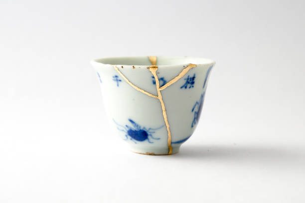 istock Antique broken Japanese blue cup repaired with gold kintsugi technique 1280390345