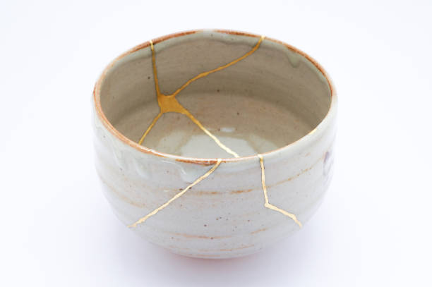 istock Antique broken Japanese tea matcha bowl repaired with gold kintsugi technique 1280391349