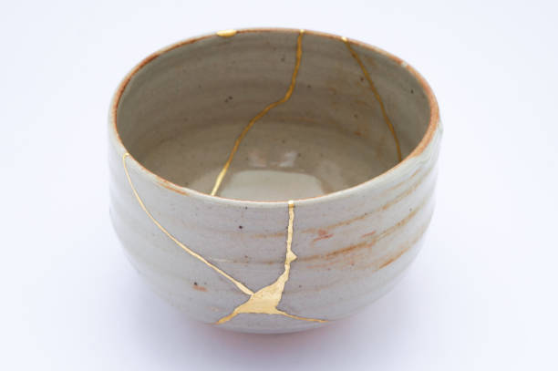 istock Antique broken Japanese tea matcha bowl repaired with gold kintsugi technique 1280391350