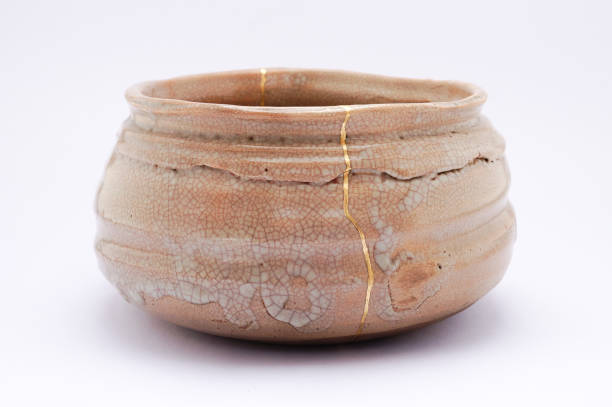 istock Antique broken Japanese tea matcha bowl repaired with gold kintsugi technique 1280391351