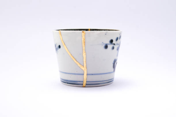 istock Antique broken Japanese blue cup repaired with gold kintsugi technique 1280391368