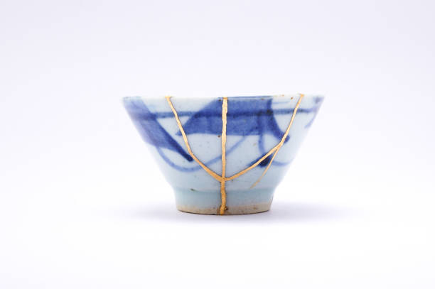 istock Antique broken Japanese blue cup repaired with gold kintsugi technique 1280391371