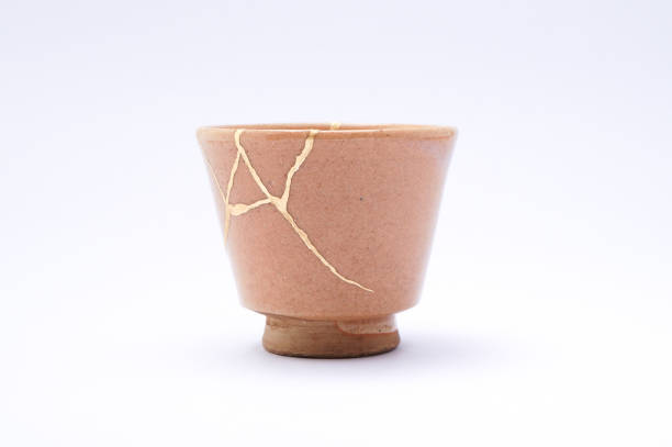 istock Antique broken Japanese cup repaired with gold kintsugi technique 1280391372