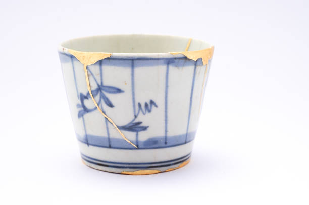 istock Antique broken Japanese blue cup repaired with gold kintsugi technique 1280391385