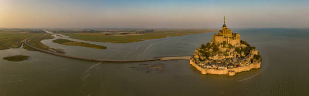 Mont Saint Michel aerial views at sunset in Normandy France