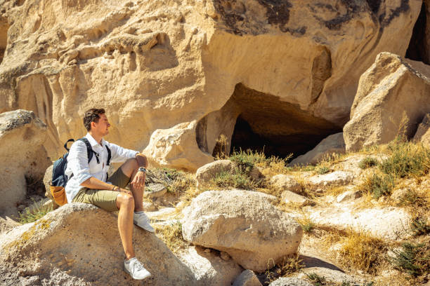 istock Man sitting on rocks in Cappadocia 1280393662