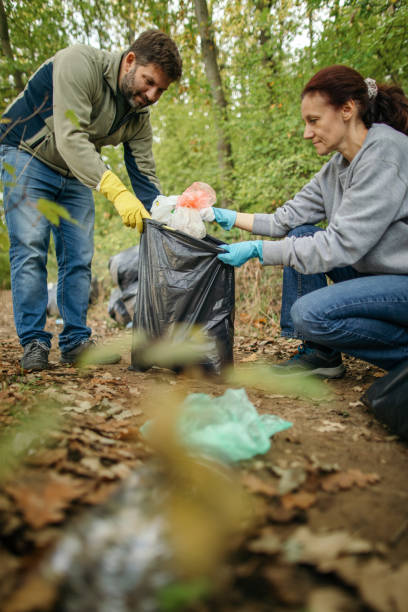 istock Collecting garbage in nature 1280398693