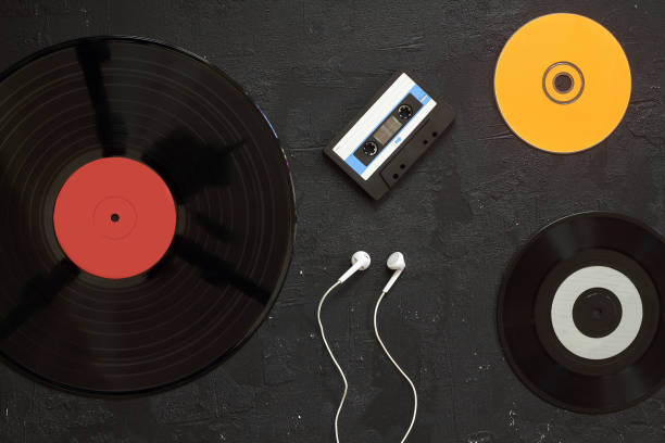 istock Vinyl record, cd, audio and video cassettes top view 1280399811