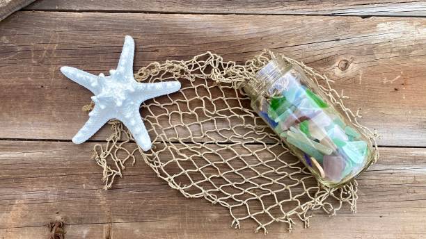 white star fish sea glass in jar.