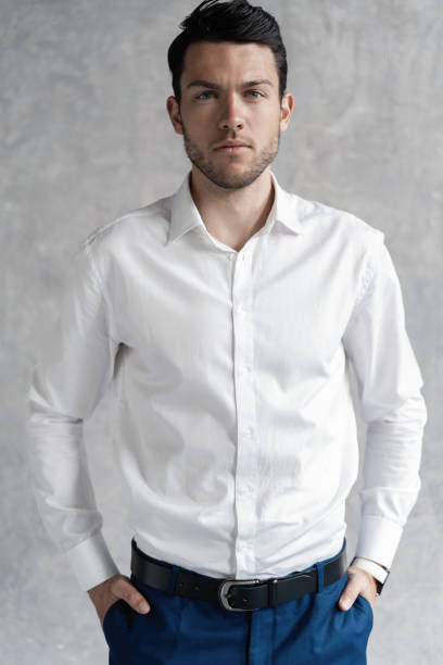 istock Handsome man wear blue suit isolated on grey background. 1280401824