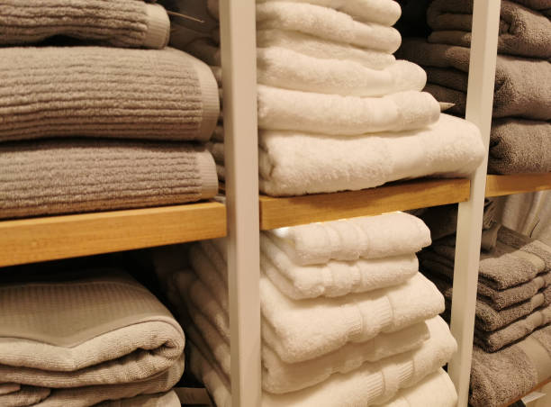 istock Stack of towel in the shelf by there are beige colors. 1280402001