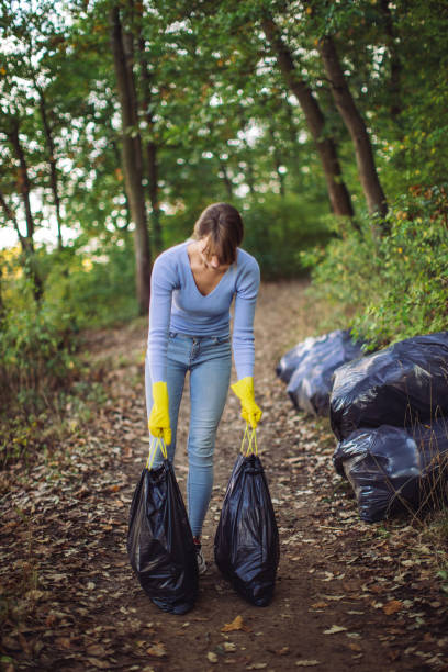 istock Collecting garbage in nature 1280403001