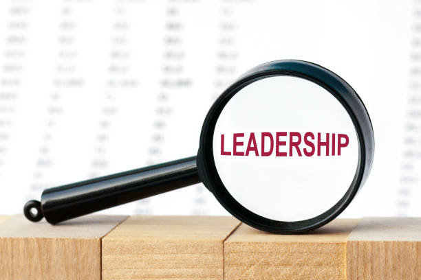 istock Look closely and LEADERSHIP with a magnifying glass , business concept image with soft focus background 1280406252