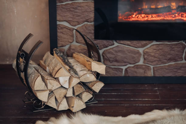 istock Pile of logs next to the fireplace. 1280408590