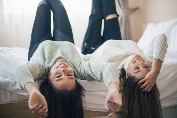 istock Two young women friends sharing happy time together 1280409042