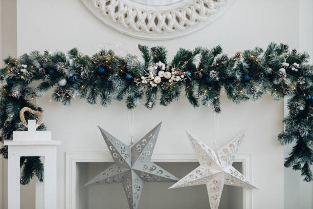 istock Beautiful fireplace with mirror and fur branches. 1280409920