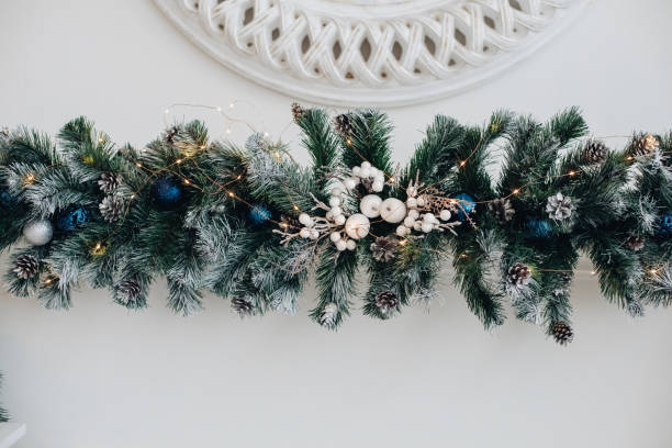 istock Beautiful fireplace with mirror and fur branches. 1280409935