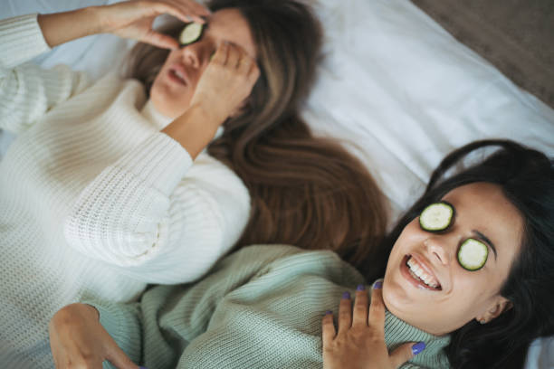 istock Two young women friends sharing happy time together 1280410271