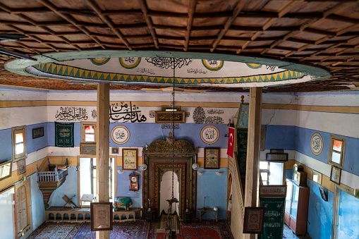 Interior of medieval mosque in Sarihacilar, Akseki, Antalya, Turkey. The mosque has unique Ottoman style woodworkings ornaments. No people are seen in frame. Shot with a full frame mirrorless camera.
