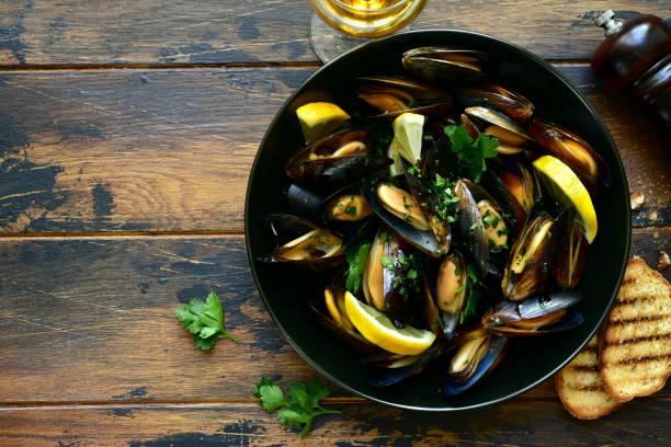 istock Boiled mussels with lemon and parsley 1280415137