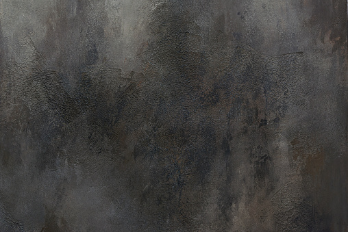 Dark matt slate, stone or concrete background.