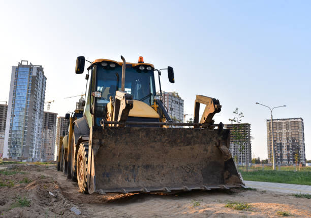 istock Yellow tractor with bucket at construction site 1280415751