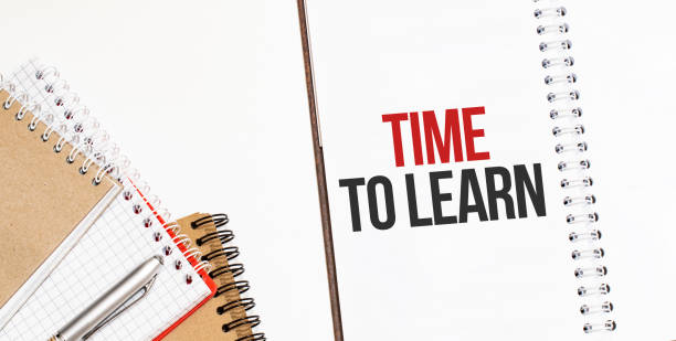 istock Notepads on the white background. Text TIME TO LEARN 1280417682