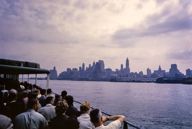 New York City in the 1950's. New York City comprises 5 boroughs sitting where the Hudson River meets the Atlantic Ocean. At its core is Manhattan, a densely populated borough that’s among the world’s major commercial, financial and cultural centers. Its iconic sites include skyscrapers such as the Empire State Building and sprawling Central Park. Broadway theater is staged in neon-lit Times Square.