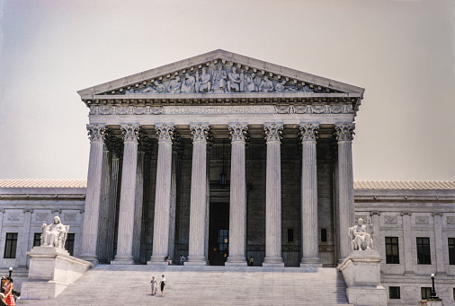 The Supreme Court Building houses the Supreme Court of the United States. Completed in 1935, it is in Washington, D.C. at 1 First Street, NE, in the block immediately east of the United States Capitol. The building is managed by the Architect of the Capitol. On May 4, 1987, the Supreme Court Building was designated a National Historic Landmark. Copyright has expired on this artwork. Digitally restored. Historic photos shows the U.S. Capitol in 1950 and its surrounding areas of Washington D.C.