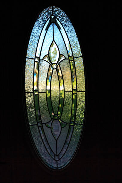istock Stained glass window with iron detail and a blue sky 1280424278