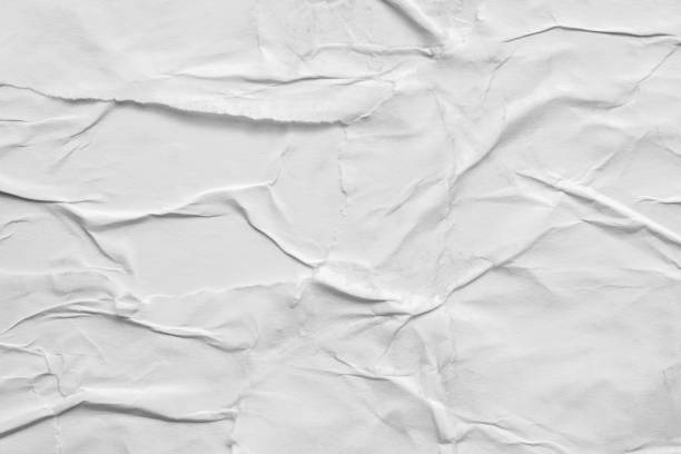 istock Blank white crumpled and creased paper poster texture background 1280425580