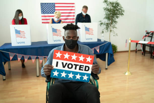 Handicapped Afro-American man on Election Day