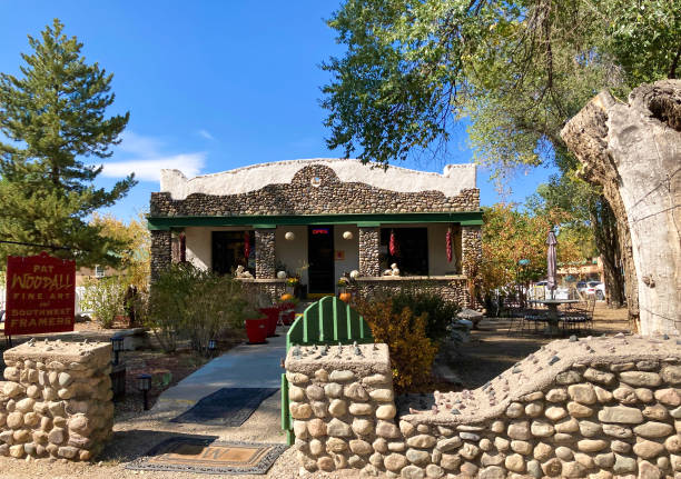 Taos, NM: An old stone building housing an art gallery in historic downtown Taos.