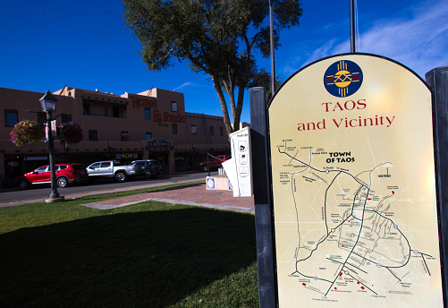 Taos, NM: A map of Taos and vicinity on the historic Taos Plaza. Hotel La Fonda is in the background.