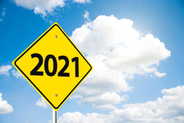 istock Road sign 2021 on sky 1280428617