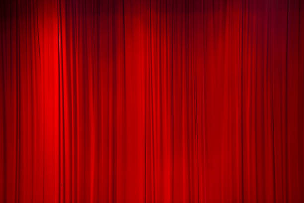 istock Red curtain background or backdrop copy-space, with folds and creases. 1280436788