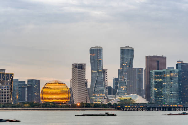istock City Skyline By River Against Sky at twilight 1280438496