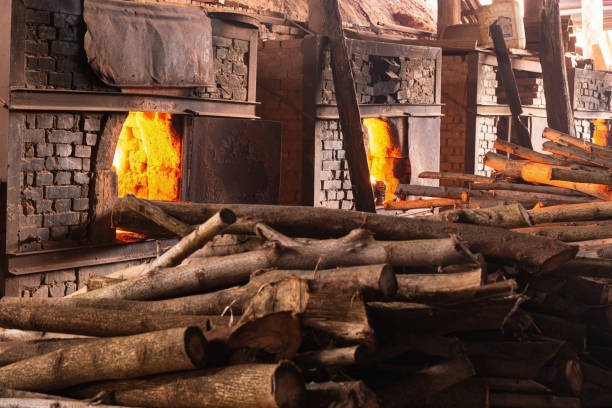 istock Firewood burning in industrial oven. Brick yard. 1280440887