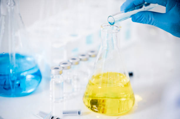 istock Hand of a scientist working in the laboratory. Vaccine development concept. 1280443304