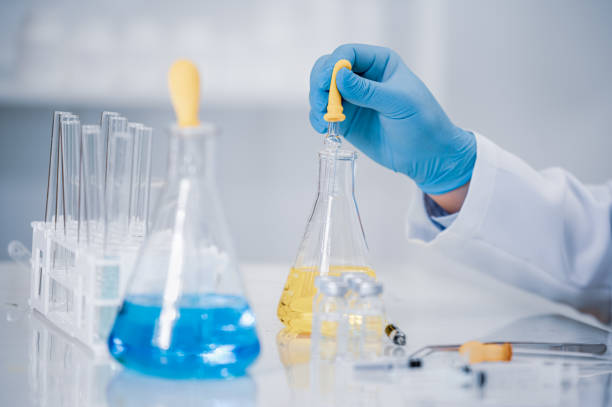 istock Hand of a scientist working in the laboratory. Vaccine development concept. 1280443364