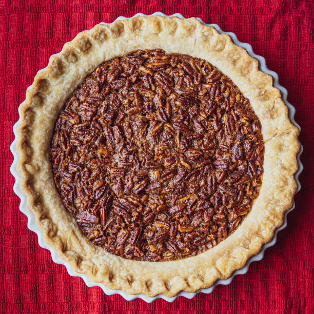 istock Homemade Pecan Pie on Red Cloth 1280446075
