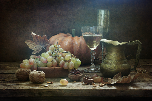 Still-life with wine, walnuts and grapes