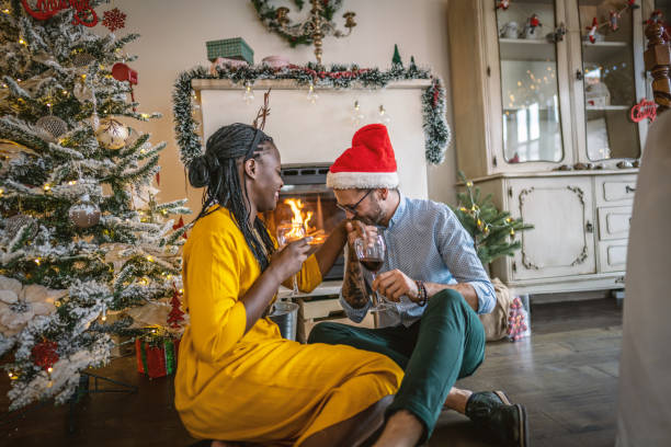 istock Happy couple celebrating Christmas at home 1280448518