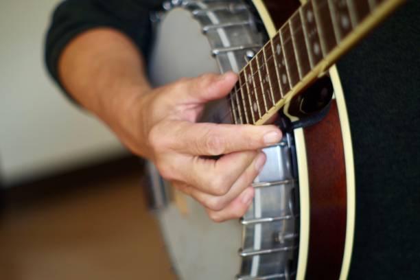 istock Close up of hands playing the banjo 1280450569