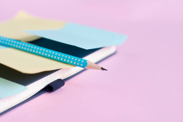 istock stationery minimal concept on pink background. Notepad with with stickers for notes. Copy space place for text. 1280452498