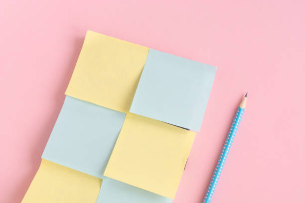 istock stationery minimal concept on pink background. Notepad with with stickers for notes. Copy space place for text. 1280452499