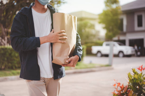 istock Food delivery man 1280453366