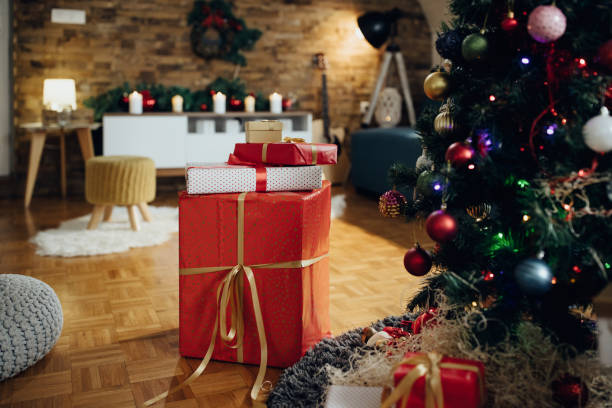 istock Wrapped presents under the Christmas tree at home. 1280454026