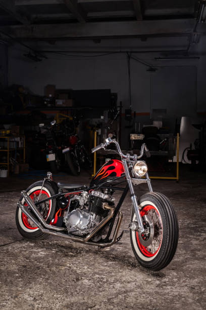 Custom bobber motorbike in an workshop garage. stock photo